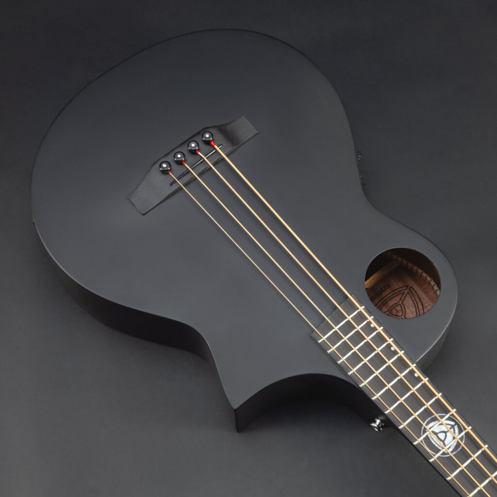 Matte-black Neptune V2 bass body with offset soundhole