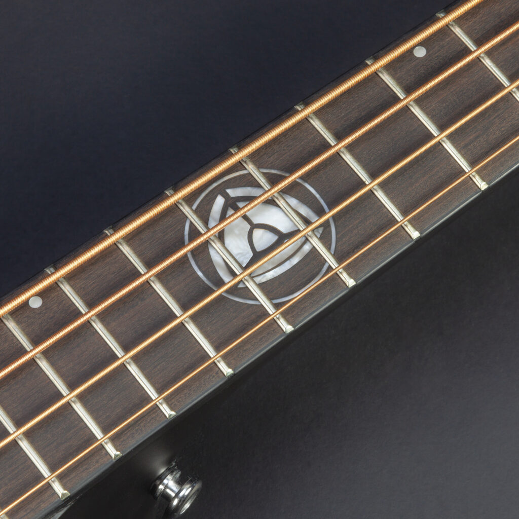 Planet Core inlay at the twelfth fret of the Neptune V2