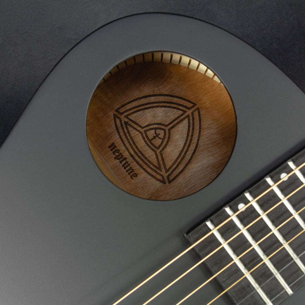 Neptune offset soundhole and engraved interior detail